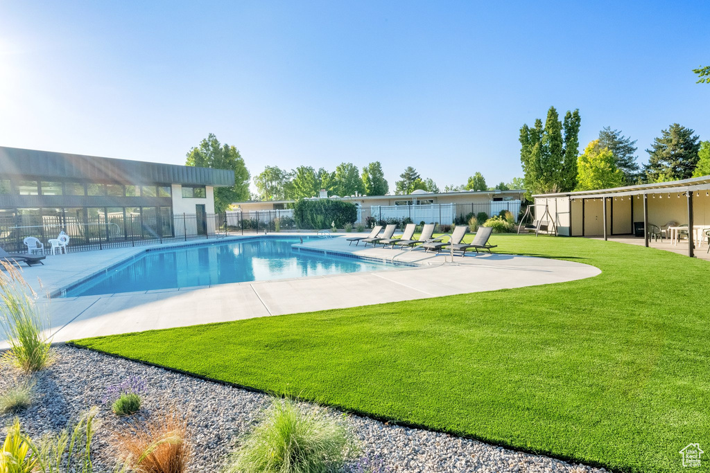 Community pool with a patio area