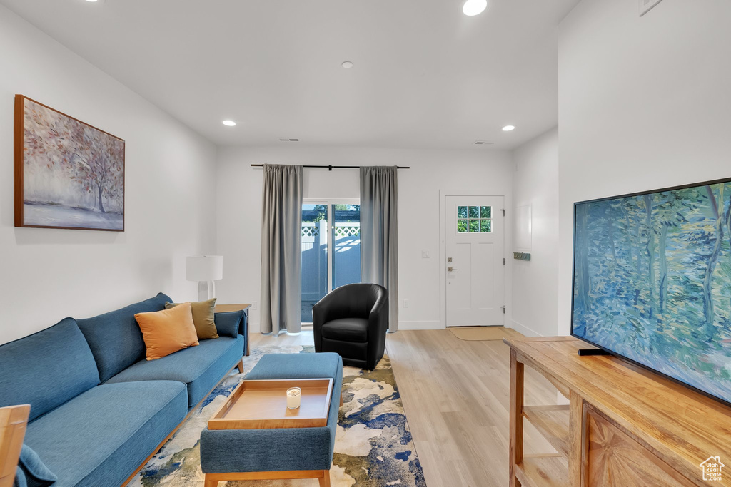 Living room featuring recessed lighting and light wood finished floors
