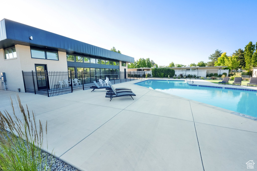 Community pool featuring a patio area