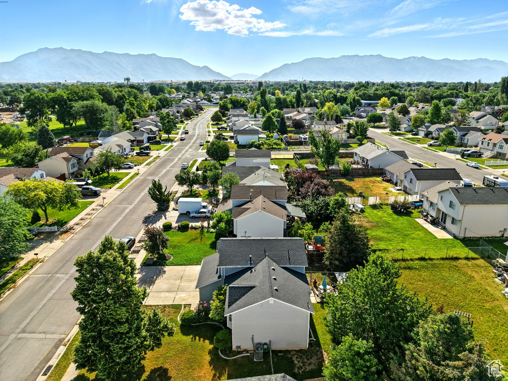 Aerial view of residential area featuring a mountain backdrop
