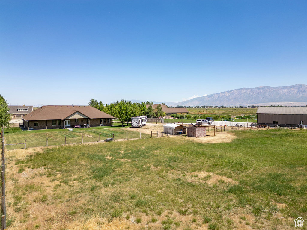 View of yard with a mountain view and a view of countryside