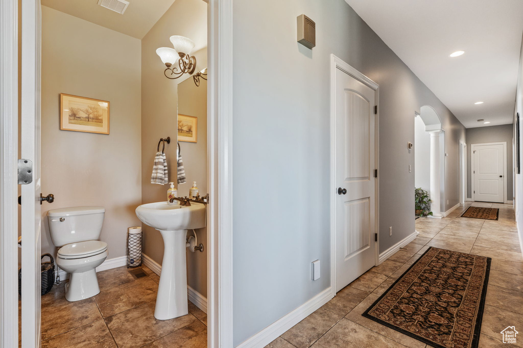 Bathroom featuring tile patterned flooring and recessed lighting