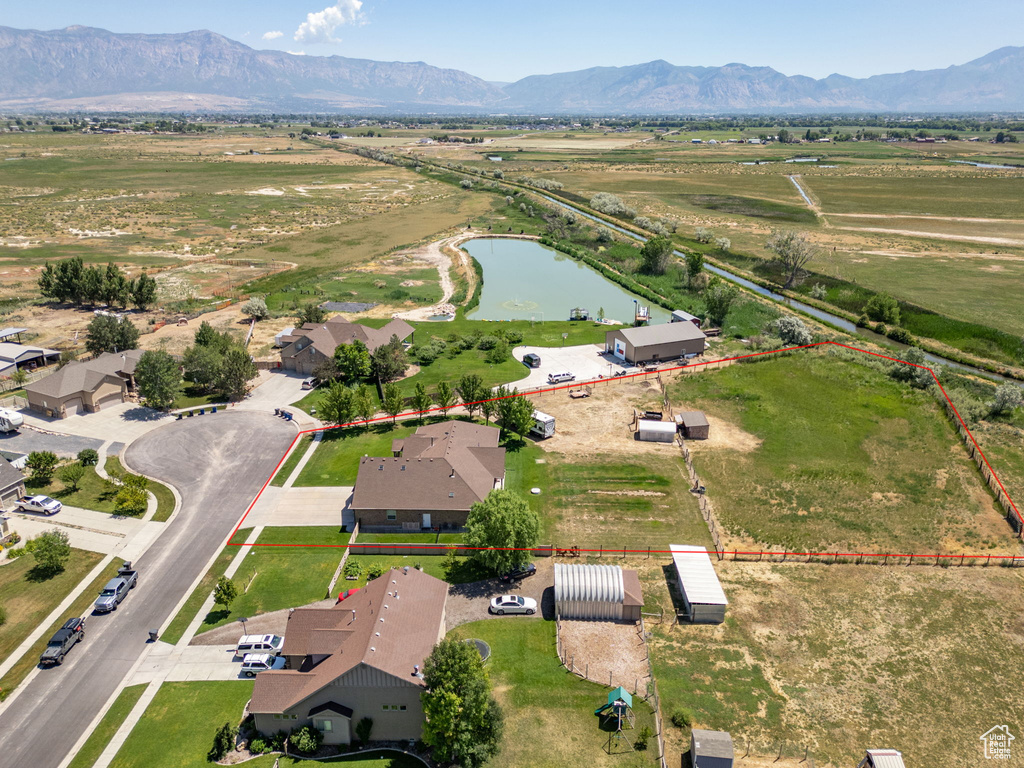 Aerial view of property\\\'s location featuring property parcel outlined and a water and mountain view