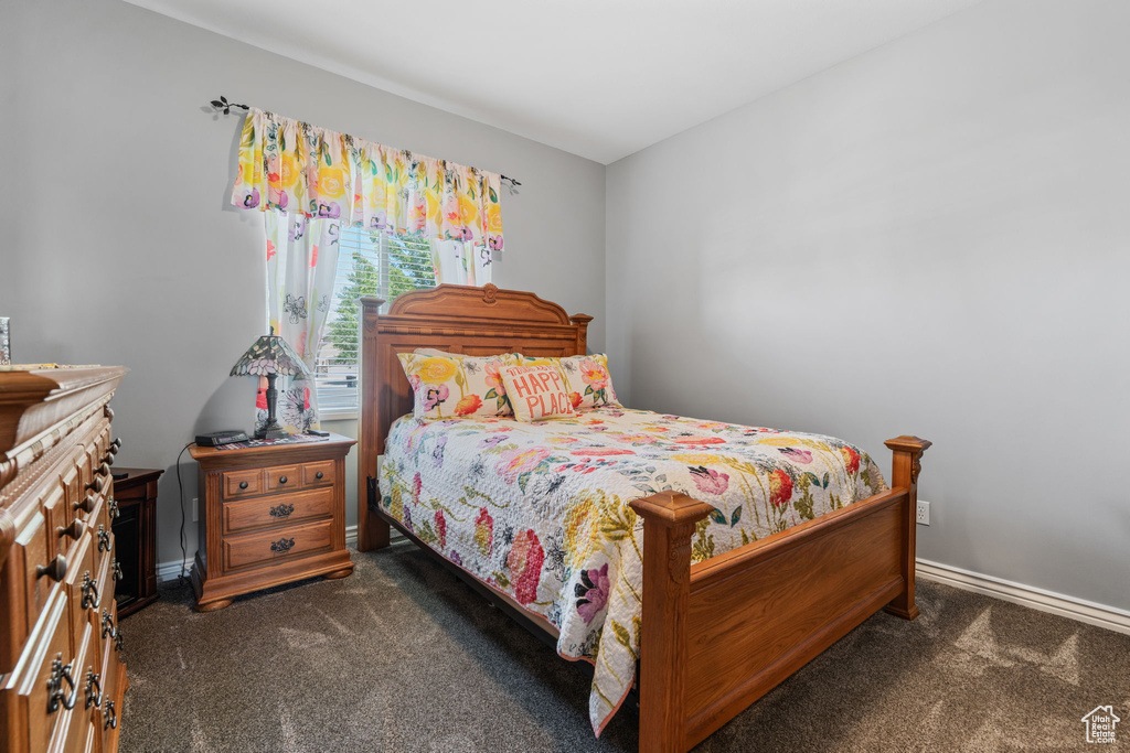 Carpeted bedroom with baseboards