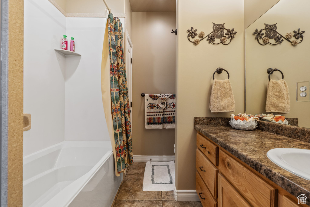 Full bathroom featuring vanity and toilet