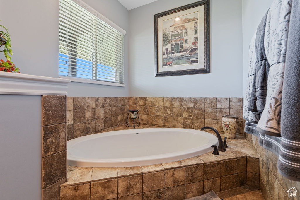 Full bathroom featuring a garden tub