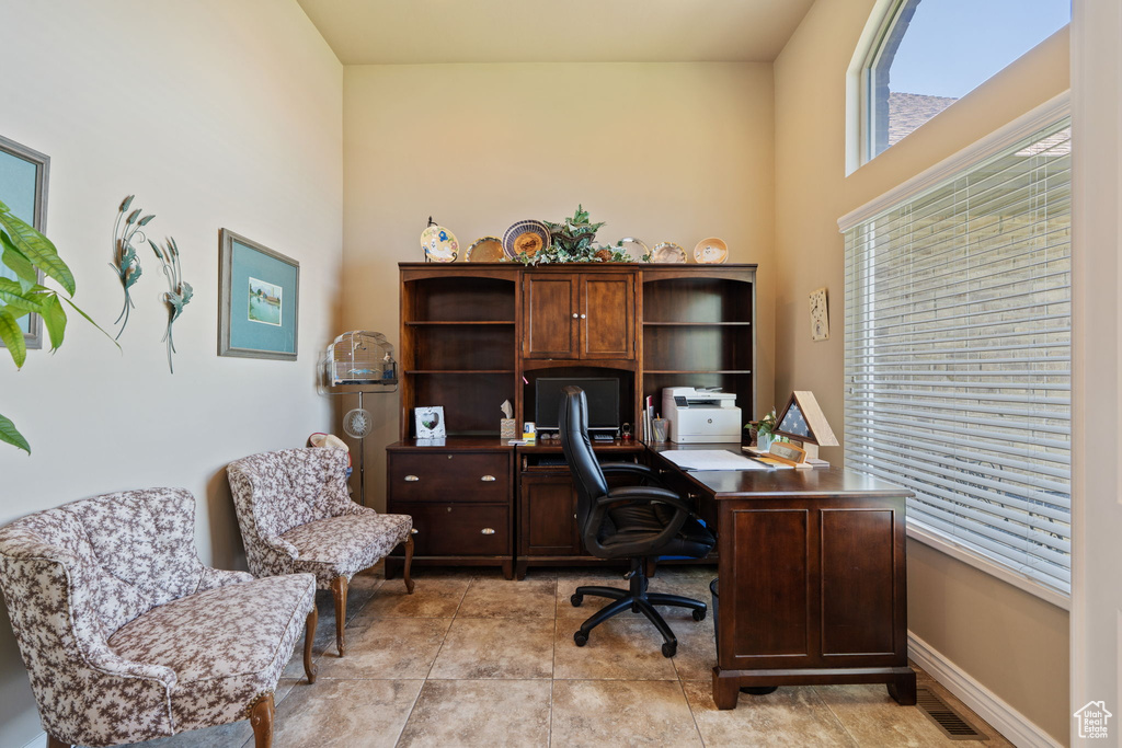 Office space with light tile patterned floors