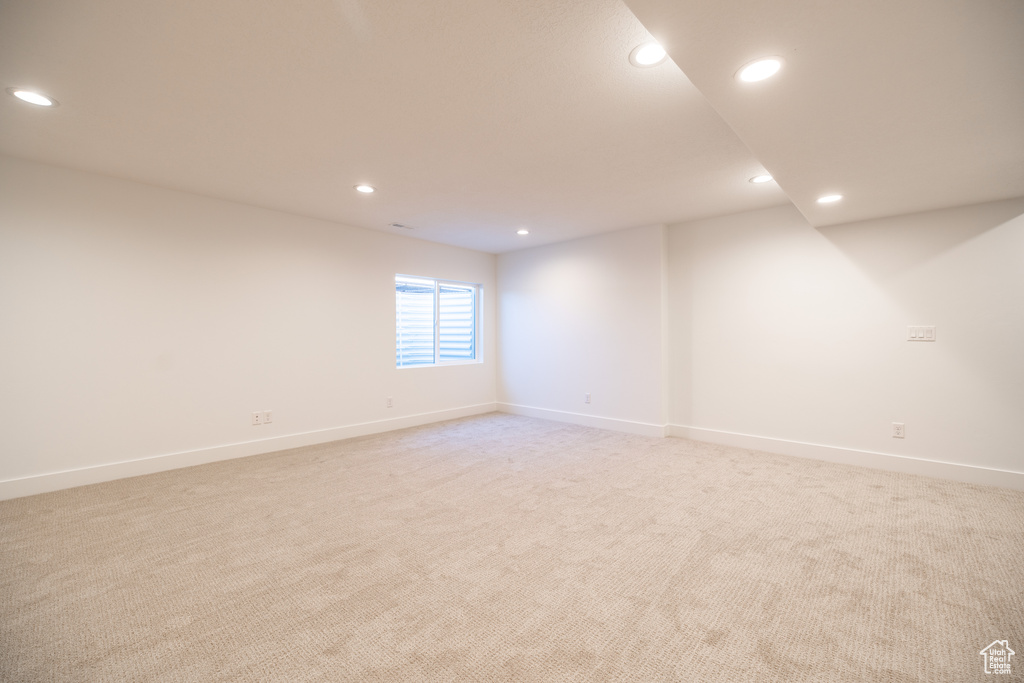 Unfurnished room featuring recessed lighting and light carpet