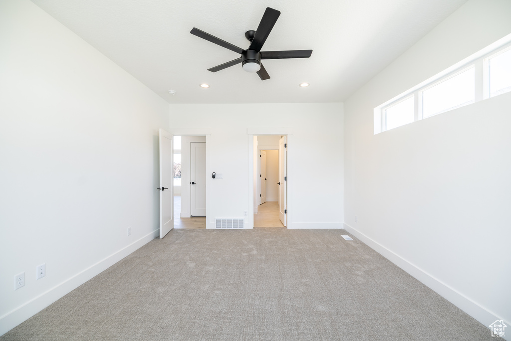 Unfurnished bedroom with recessed lighting and light colored carpet