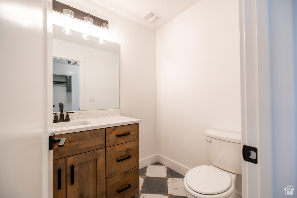 Bathroom with toilet and vanity