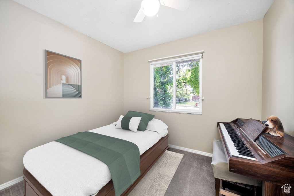 Bedroom featuring carpet floors and a ceiling fan