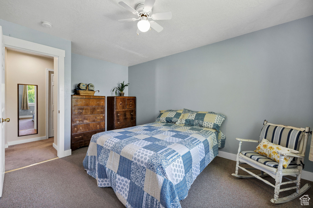 Bedroom with carpet and a ceiling fan