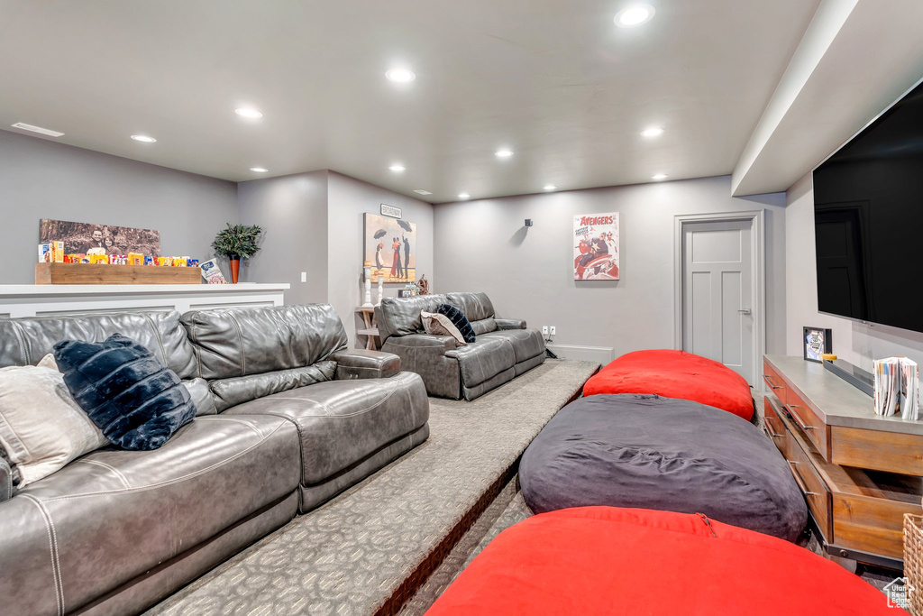 Living room with carpet floors and recessed lighting