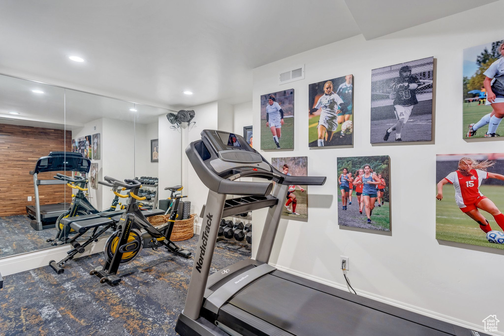 Exercise area featuring recessed lighting and baseboards
