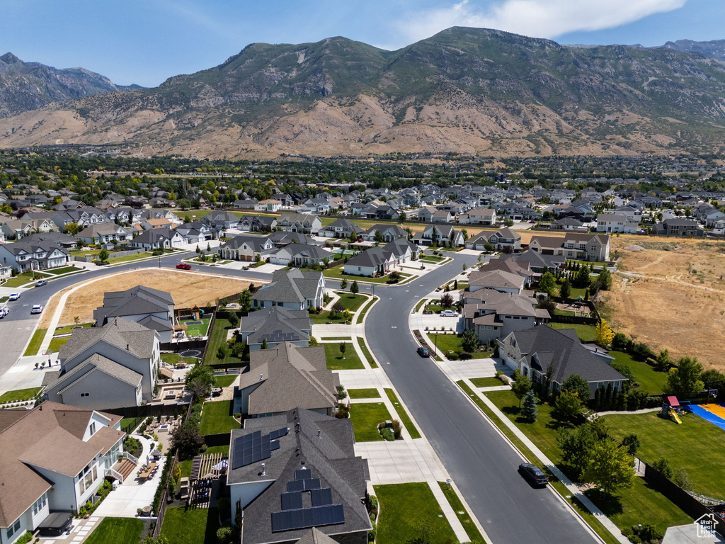 View of property location featuring a mountainous background and nearby suburban area