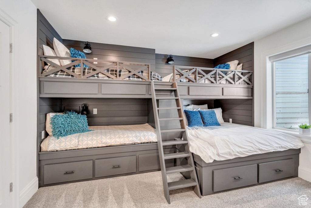 Carpeted bedroom with recessed lighting