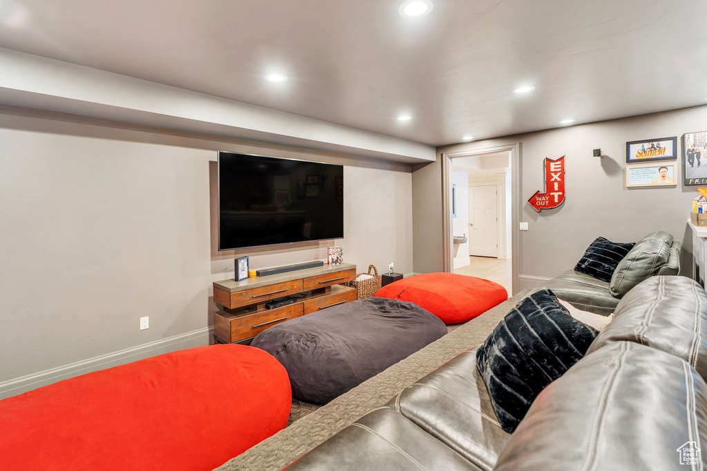 Living area with recessed lighting and baseboards