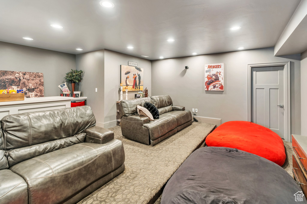 Living room with recessed lighting and carpet