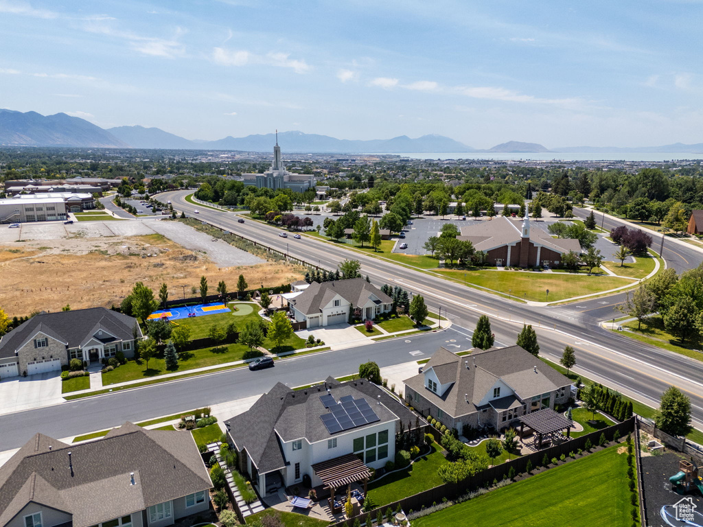 Aerial view of residential area featuring a mountain backdrop