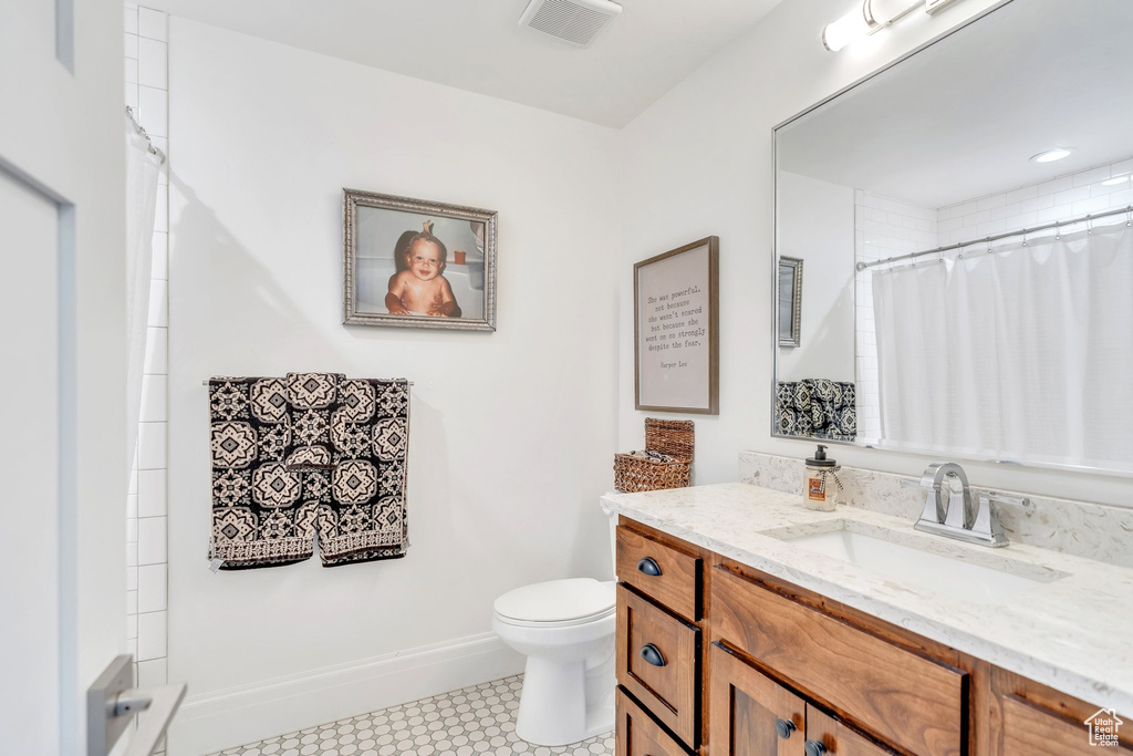 Bathroom with vanity and a shower with curtain