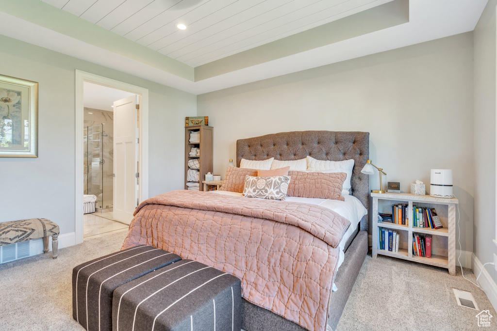 Carpeted bedroom with recessed lighting, a raised ceiling, connected bathroom, and wooden ceiling