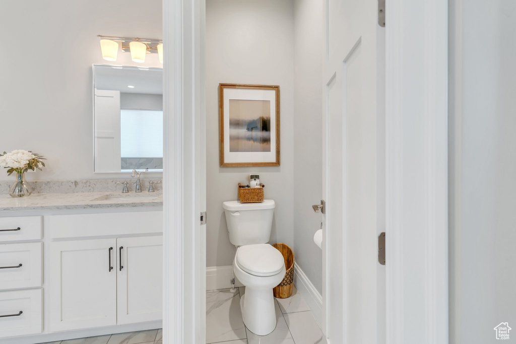 Bathroom featuring vanity and toilet