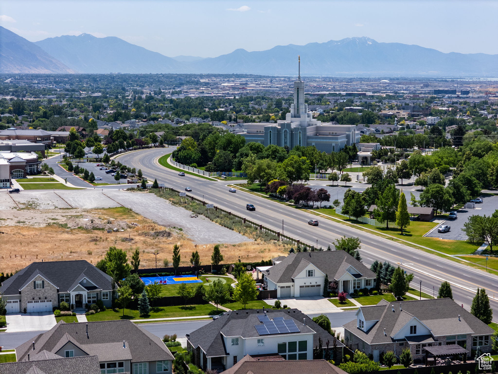 Aerial perspective of suburban area with a mountain backdrop