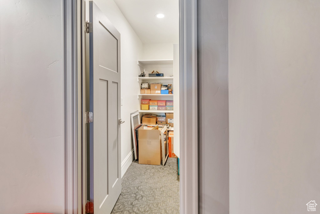 Hall with carpet flooring and recessed lighting