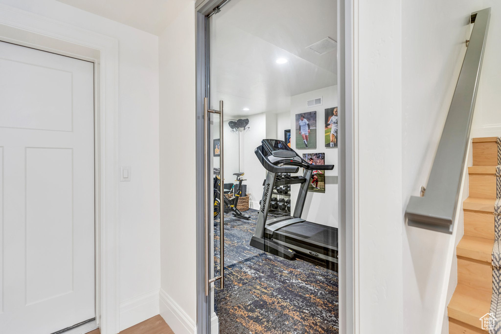 Exercise area featuring baseboards and recessed lighting