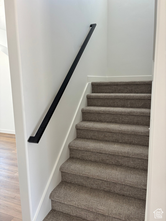 Stairway with wood finished floors