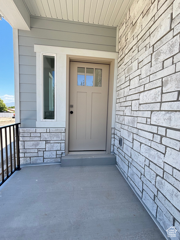 Property entrance with stone siding