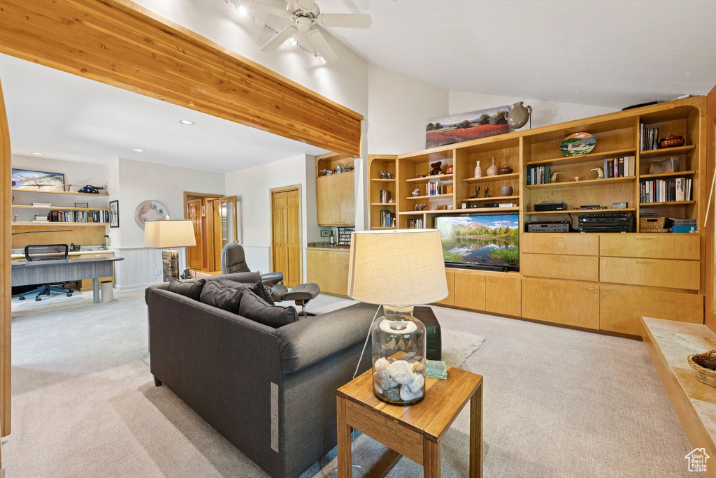 Living area with light colored carpet, vaulted ceiling, an office area, ceiling fan, and recessed lighting