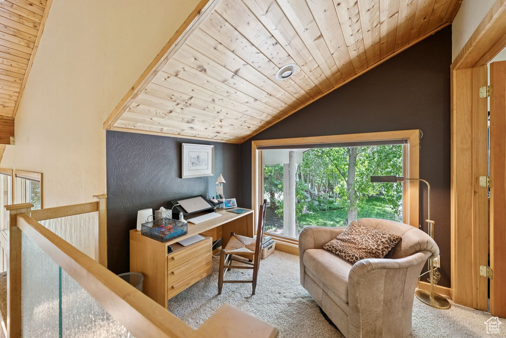 Home office featuring wooden ceiling, vaulted ceiling, and carpet