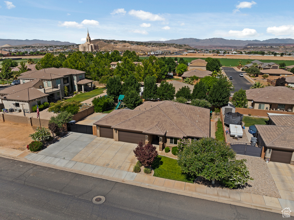 Aerial perspective of suburban area featuring a mountainous background