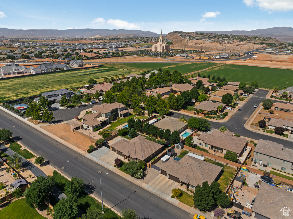 Aerial view of property\'s location with a mountain backdrop and nearby suburban area