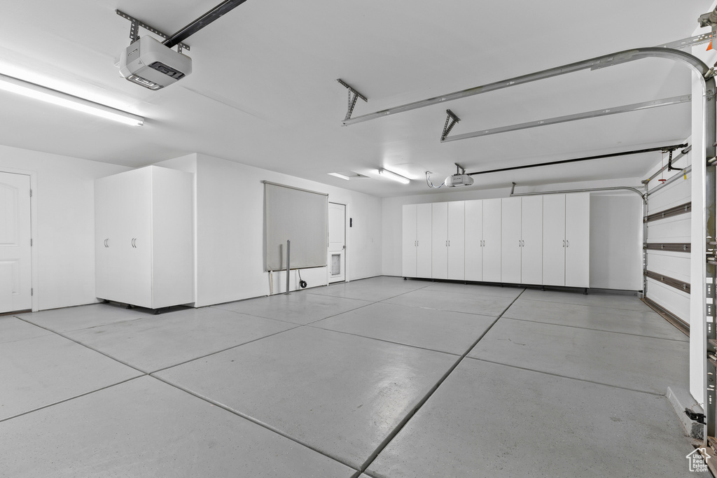 Garage featuring a garage door opener