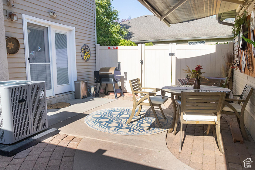 View of patio / terrace featuring outdoor dining space and a grill