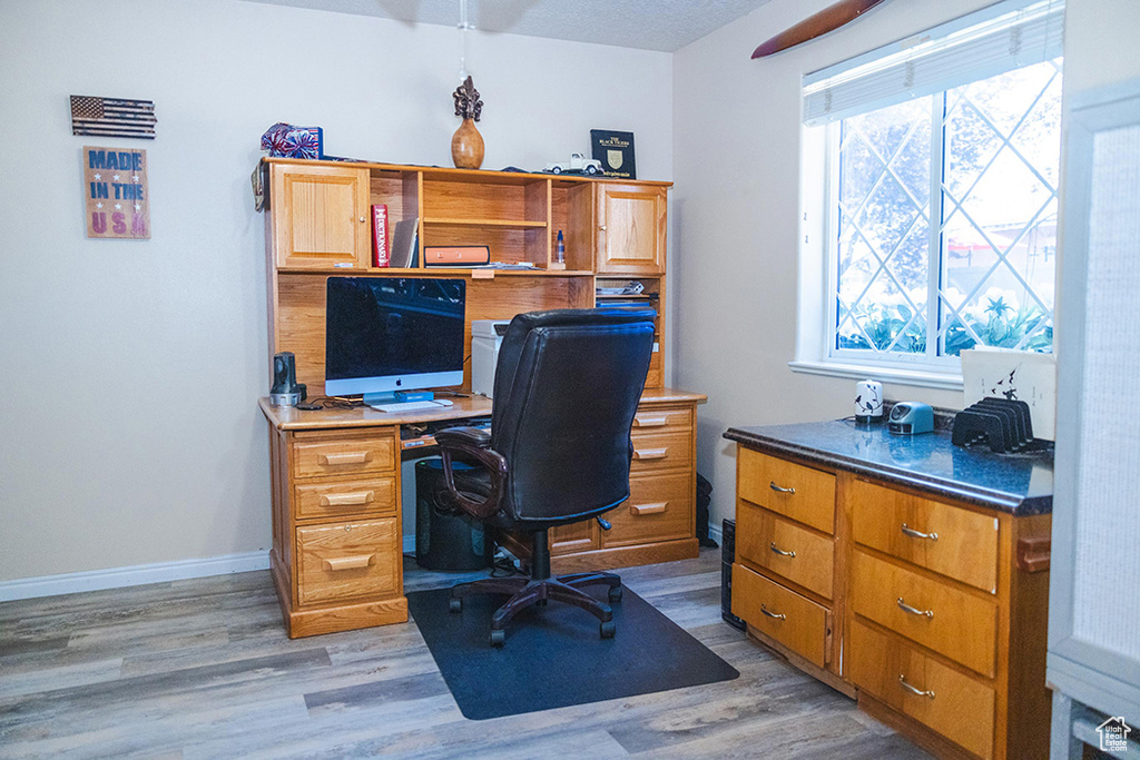 Home office featuring light wood-style flooring