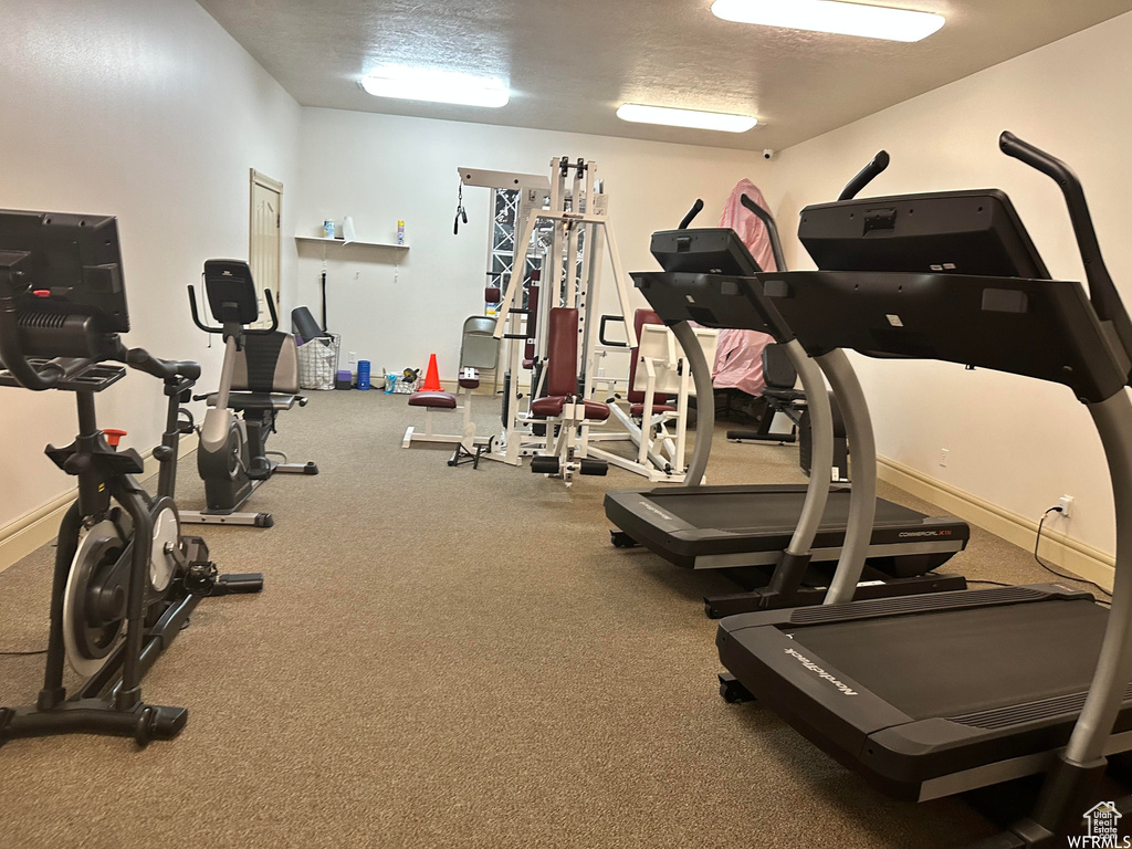 Exercise room with a textured ceiling