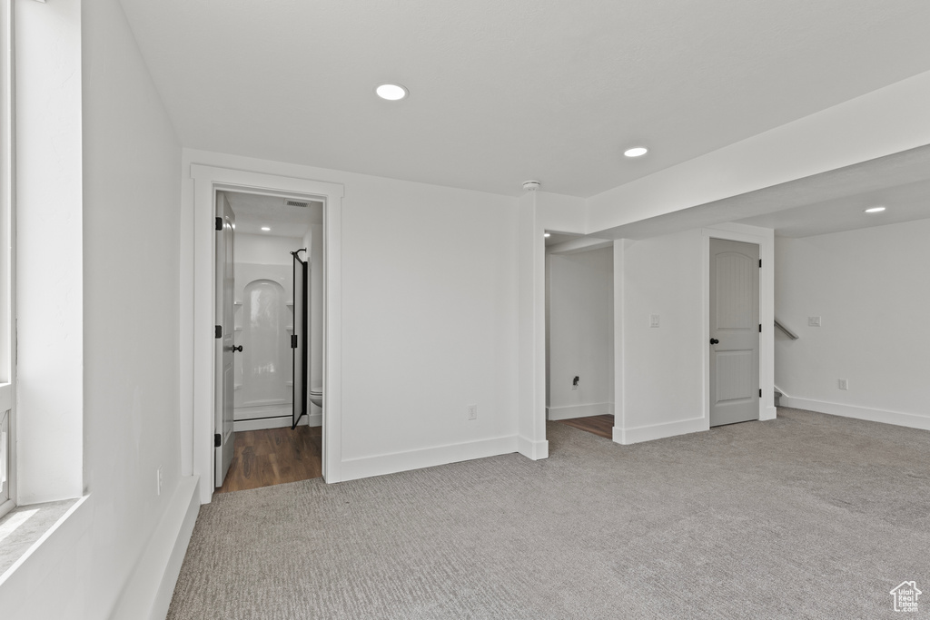 Unfurnished bedroom with carpet flooring, recessed lighting, and ensuite bathroom