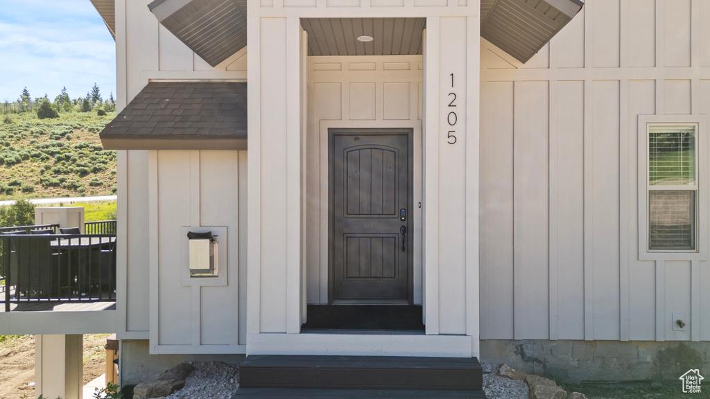 Entrance to property featuring board and batten siding