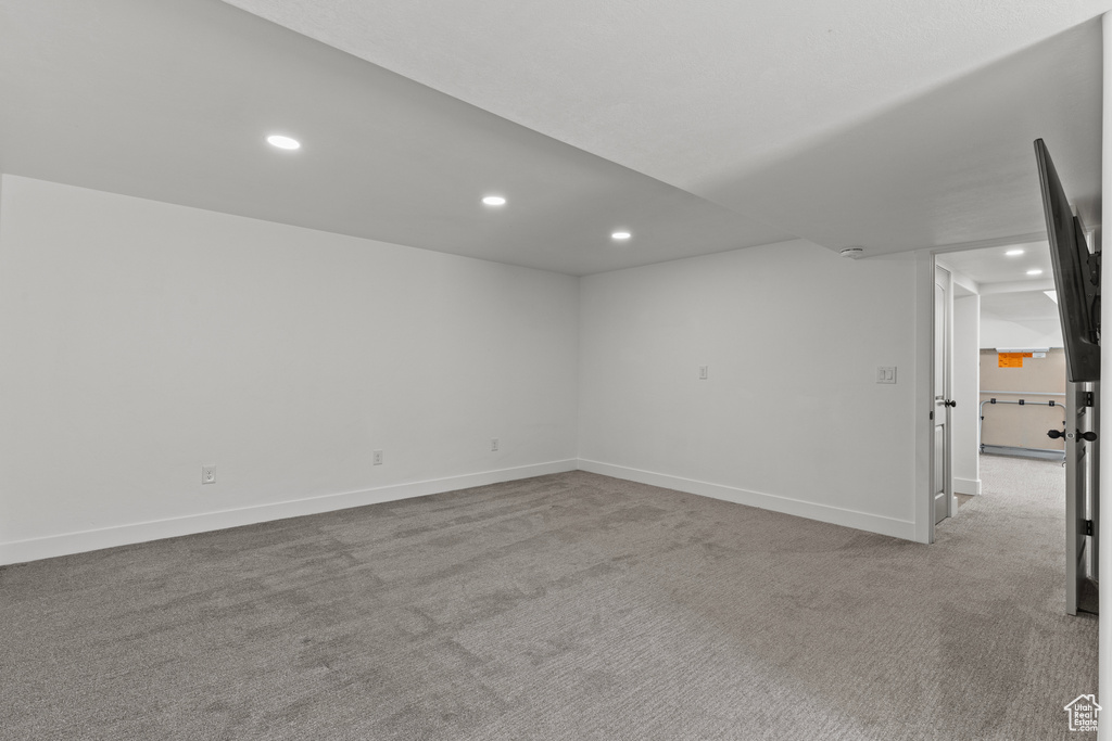 Spare room with recessed lighting and carpet floors