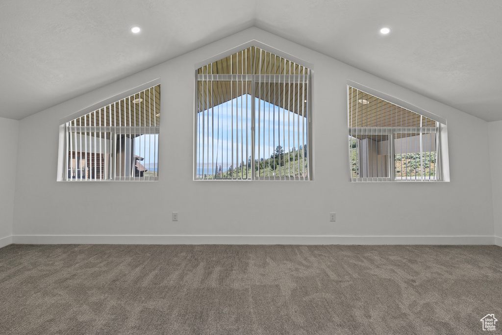 Bonus room with carpet flooring, lofted ceiling, and recessed lighting