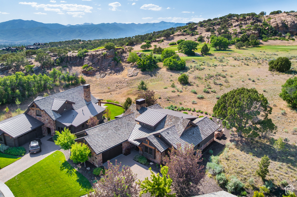 View of subject property with a mountain backdrop