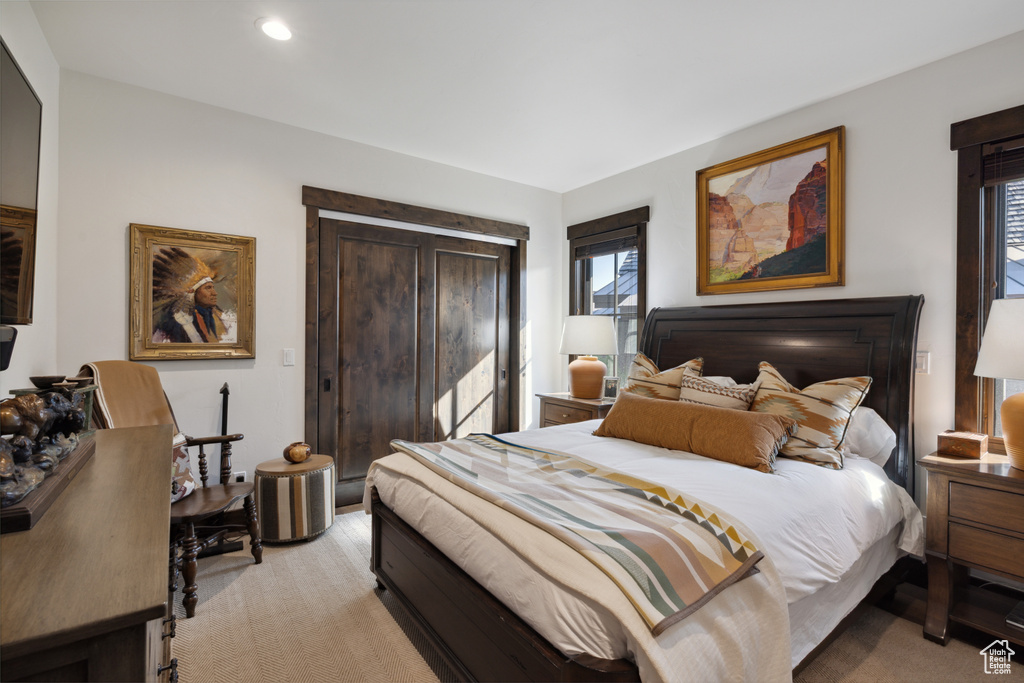 Bedroom featuring light carpet and recessed lighting