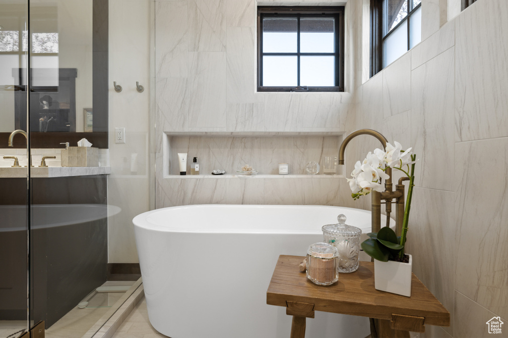 Bathroom with a freestanding tub and vanity