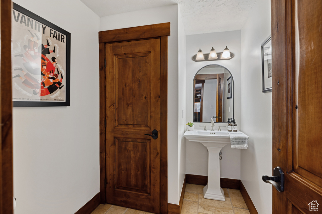 Bathroom featuring baseboards