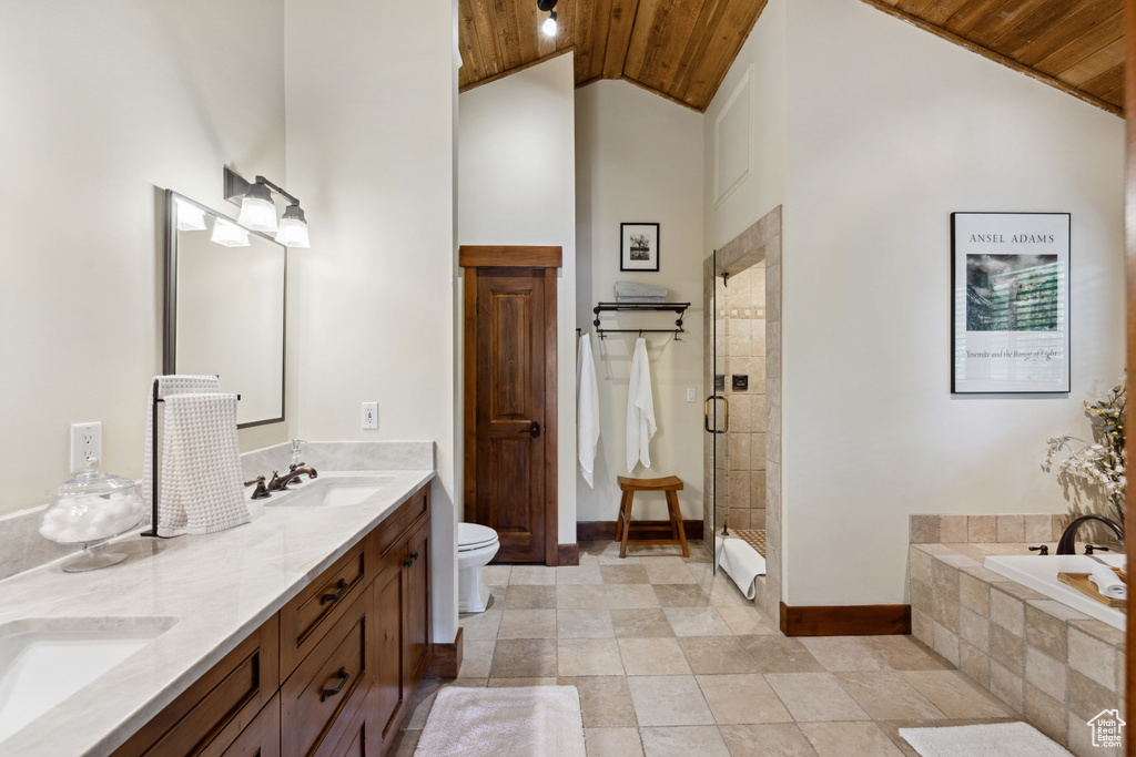 Full bathroom featuring wood ceiling, double vanity, a bath, a stall shower, and high vaulted ceiling