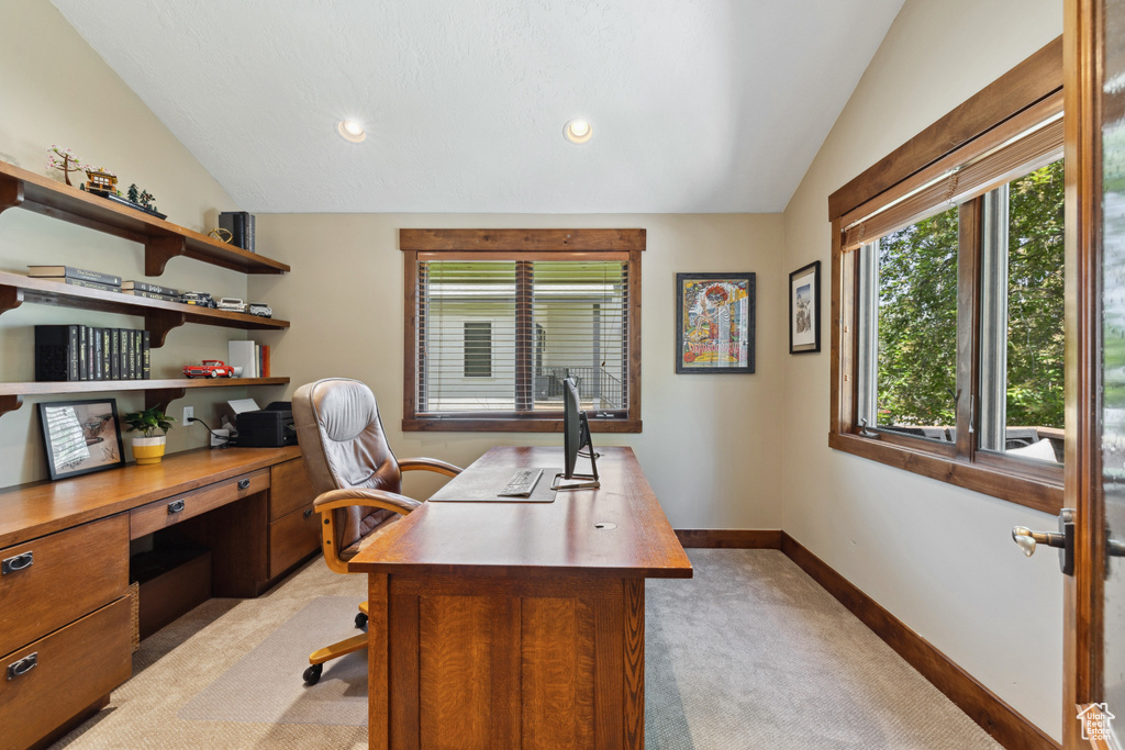 Office area featuring vaulted ceiling, light carpet, and recessed lighting