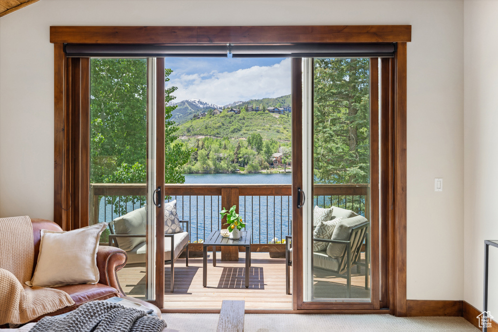 Entryway featuring a mountain view and carpet floors